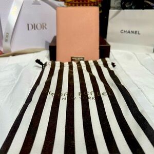 Henri Bendel EUC baby pink midsized wallet with gold hardware and dust bag.